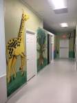 Giraffe and tree with animals in it wall decoration.